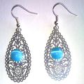 Boucles d'oreilles orientales oeil de chat bleu