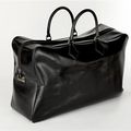 HERMÈS. Grand sac de voyage "Plume" en cuir noir, marqué des initiales "BD". 