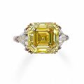 A fancy colored diamond and diamond ring