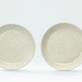 Two small carved Ding 'lotus' dishes, Northern Song dynasty (960-1127)
