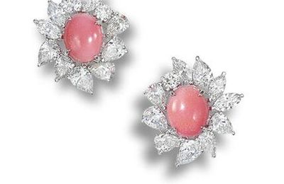 A pair of conch pearl and diamond earrings