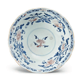 A blue and white, copper red and celadon-glazed shallow bowl, Qianlong mark and period