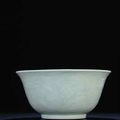 A rare large carved celadon bowl. Yongzheng six-character sealmark and of the period (1723-1735) 