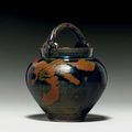 A brown-painted blackish-brown-glazed jar with rope-twist handle, Song dynasty, 12th-13th century 