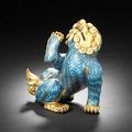 A cloisonné-enamelled and gilt-bronze figure of a lion. Kangxi