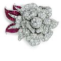 A diamond and ruby 'mystery-set' flower brooch,  by Van Cleef & Arpels 