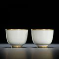 A fine pair of small white-glazed wine cups, marks and period of Kangxi (1662-1722)