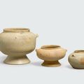 A group of three small glazed containers with green enamel splashes, Hán Việt period, 1st-4th centuries