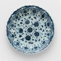 Deep dish, underglaze blue, interior floral scrolls, wave pattern at rim. Ming dynasty, early 15th century