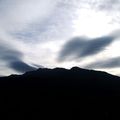 Black mountain and wavy sky