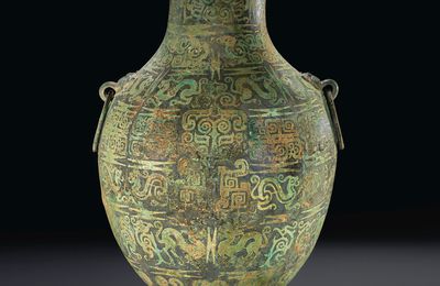 A rare copper-inlaid ritual bronze wine vessel, Hu, Warring States period (475–221 BC)