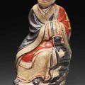 A Cizhou polychromed pottery figure of a luohan, Yuan dynasty (1279-1368)