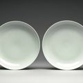 A pair of large white-glazed dishes, Qianlong seal marks and period (1736-1795)