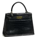 An Hermès black crocodile Kelly handbag