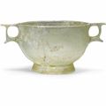 A Greek pale green glass skyphos, Hellenistic period, circa 2nd-mid 1st Century B.C.