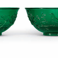 A pair of carved green glass bowls, Qing dynasty, 19th century