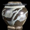 A very rare phosphatic-splashed brown glazed stoneware jar, China, Tang dynasty 