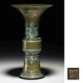 A rare gilt-decorated teadust-glazed imitation bronze beaker vase, gu, Qianlong incised and gilded sel mark and of the period