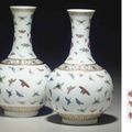 A pair of famille rose 'butterfly' vases, Guangxu six-character mark in iron red and of the period (1875-1908)