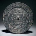 Bronze mirror of TLV type. China, Xin dynasty (9–23) 