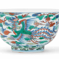 A rare pair of doucai 'dragon and phoenix' bowls, Kangxi six-character marks and of the period (1662-1722)