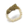 Diamond and onyx jewel, 'Tiger', Cartier, 1950s, and a natural pearl bracelet