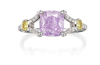 An extremely rare fancy coloured diamond and diamond ring