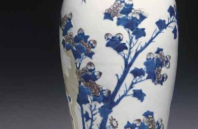 A copper-red and celadon-decorated blue and white carved baluster vase, Kangxi six-character mark and of the period (1662-1722)