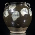 A good phosphatic-splashed brown-glazed stoneware jar, China, Tang dynasty 