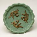 Dish with birds on fruiting peach branches. Yuan dynasty, AD 1300–1368