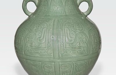 A large celadon glazed vase with incised decoration, Qianlong six-character mark and of the period (1736-1795)
