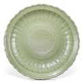 A Longquan celadon barbed 'peony' charger, Yuan-early Ming dynasty