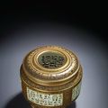 A very rare gilt-decorated 'imitation bronze' reticulated censer, Qianlong gilt six-character seal mark and of the period