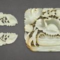 A celadon jade 'turtle' plaque and a pair of celadon jade 'floral' ornaments, Yuan-Ming Dynasty (1279-1644)