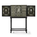 An Italian bone and ebony cabinet on stand, 17th century