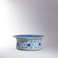 A fine and exceedingly rare large blue-and-white ‘Floral Scroll’ basin, Yongzheng mark and of the period (1723-1735)