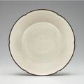 A rare Dingyao carved foliate-rimmed shallow bowl, Northern Song dynasty, 11th-12th century