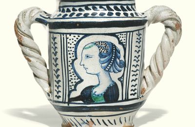 Italian, Faenza or perhaps Pesaro, circa 1500, Double handled albarello with a contour-panel portrait of a lady