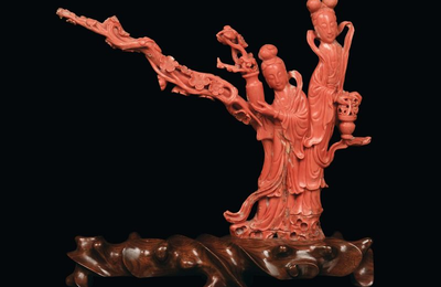 A red coral with two Guanyin figures with vases, China, Qing Dynasty, end 19th century