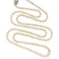A single strand natural pearl and diamond necklace