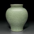A rare relief-decorated celadon-glazed baluster vase, Qianlong six-character seal mark and of the period (1736-1795)