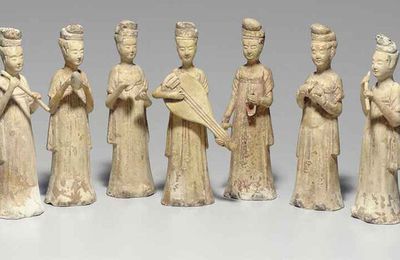 A group of nine straw-glazed female musicians and attendants, Sui dynasty (581-618)  