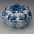 Eight-lobed covered box with blue-and-white decoration of dragons, peaches, and floral scrolls. Ming dynasty, Longqing mark and 
