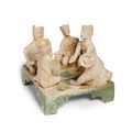 A very rare light-brown and green glazed 'drinking game' tableau, Late Western-early Eastern Han Dynasty
