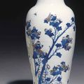 A copper-red and celadon-decorated blue and white carved baluster vase, Kangxi six-character mark and of the period (1662-1722)