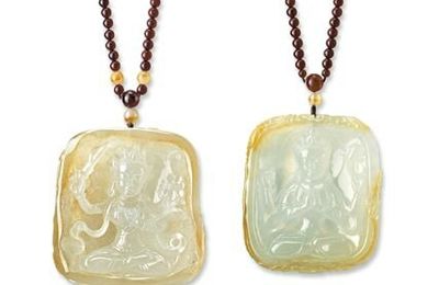 Pair of bi-coloured icy yellow jadeite 'Manjushri' and 'Guanyin' pendent necklaces, Wang Junyi