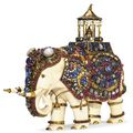 An antique ivory and multi-gem elephant 