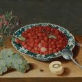 Isaak Soreau, A still life with strawberries in a Wan-li porcelain bowl, a bunch of grapes, a glass vase with columbines...