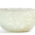 A finely carved white jade 'dragon' washer, Qing dynasty, 18th century