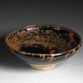 A Cizhou type black glazed stoneware bowl with russet splashes. Northern Song/Jin Dynasty